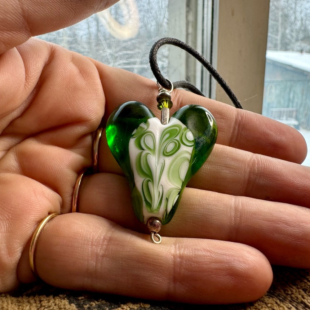Glass pendant on cord.